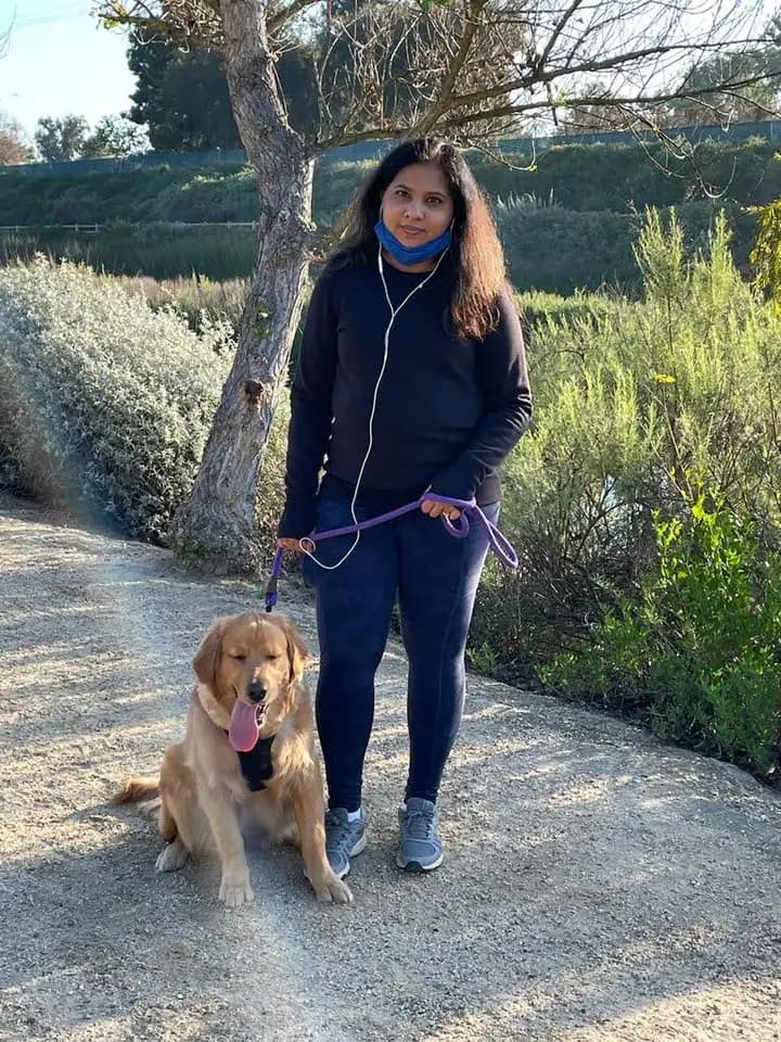 Swati outdoors with Bela.